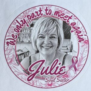 Round sticker with a photo of Julie and text 'We only part to meet again'.